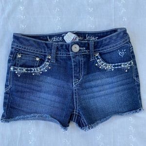 Justice Jean shorts with sequins on front and back pockets.